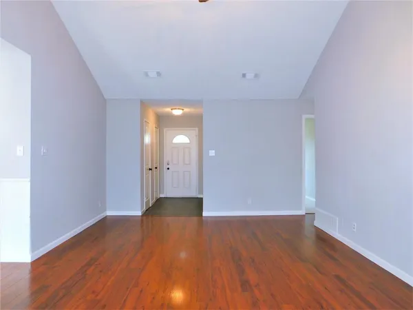 a view of wooden floor and in an empty room