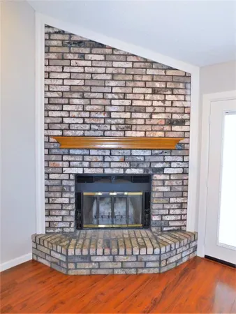 a view of fireplace and window