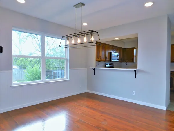 a view of a kitchen with a sink and window