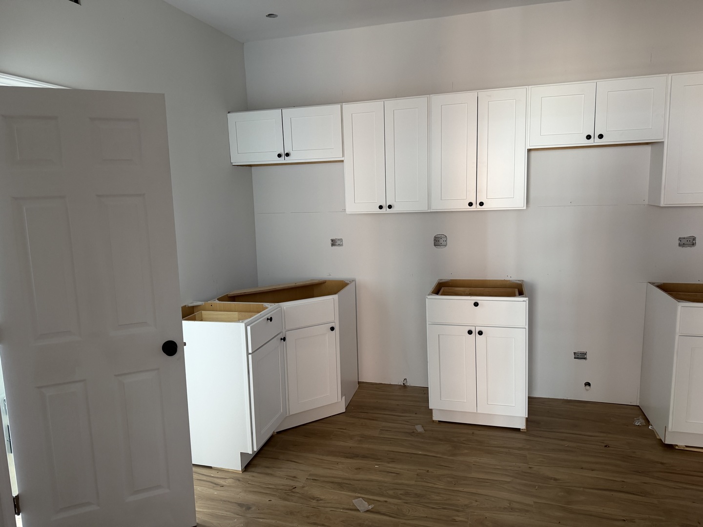 6716 South May Street Chicago, IL 60621 - Photo 3 of 9 a view of cabinets with wooden floor