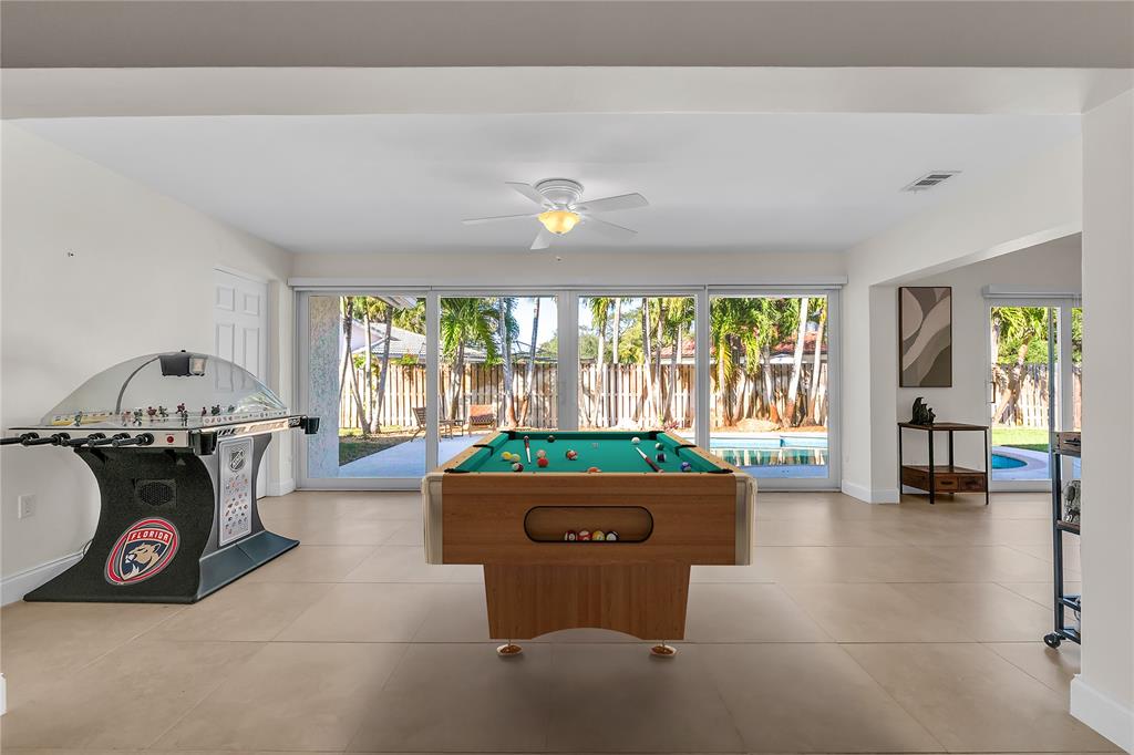 3605 Southwest 23rd Street Delray Beach, FL 33445 - Photo 18 of 50 Virtually staged billiard table to help envision the entertainment area.