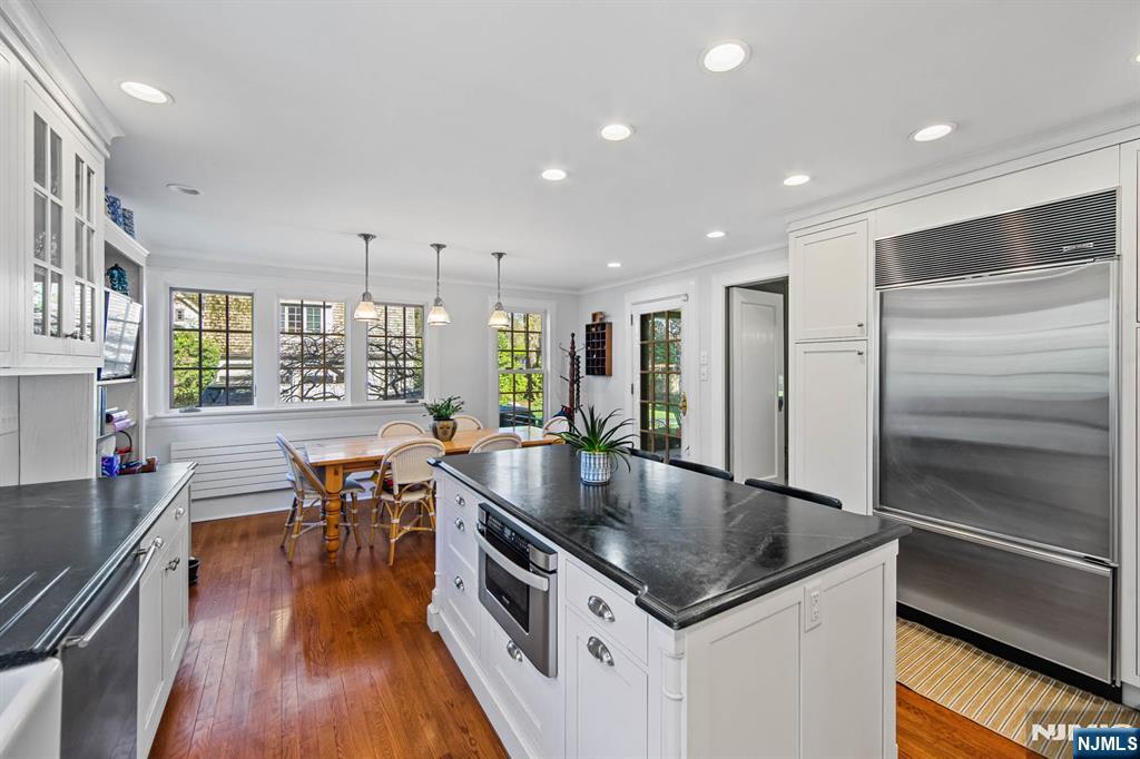 116 Lydecker Street Englewood, NJ 07631 - Photo 11 of 46 a kitchen with stainless steel appliances granite countertop a sink a stove and a refrigerator