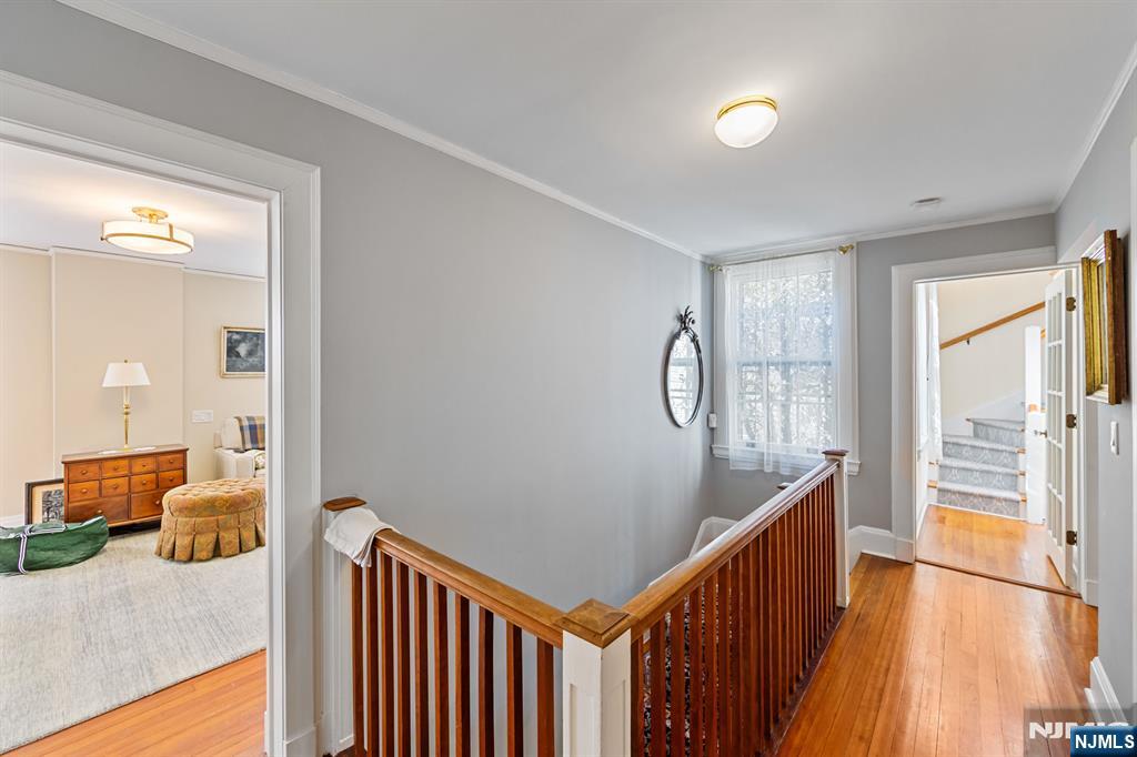116 Lydecker Street Englewood, NJ 07631 - Photo 25 of 46 a view of a hallway to a livingroom with furniture