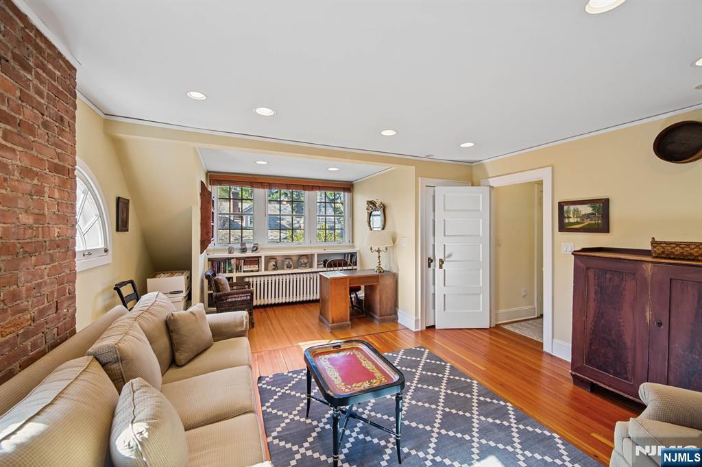 116 Lydecker Street Englewood, NJ 07631 - Photo 36 of 46 a living room with furniture and wooden floor