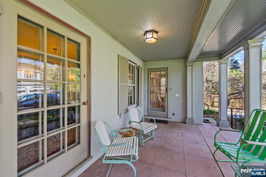 116 Lydecker Street Englewood, NJ 07631 - Photo 46 of 46 a balcony with chairs and table in a patio