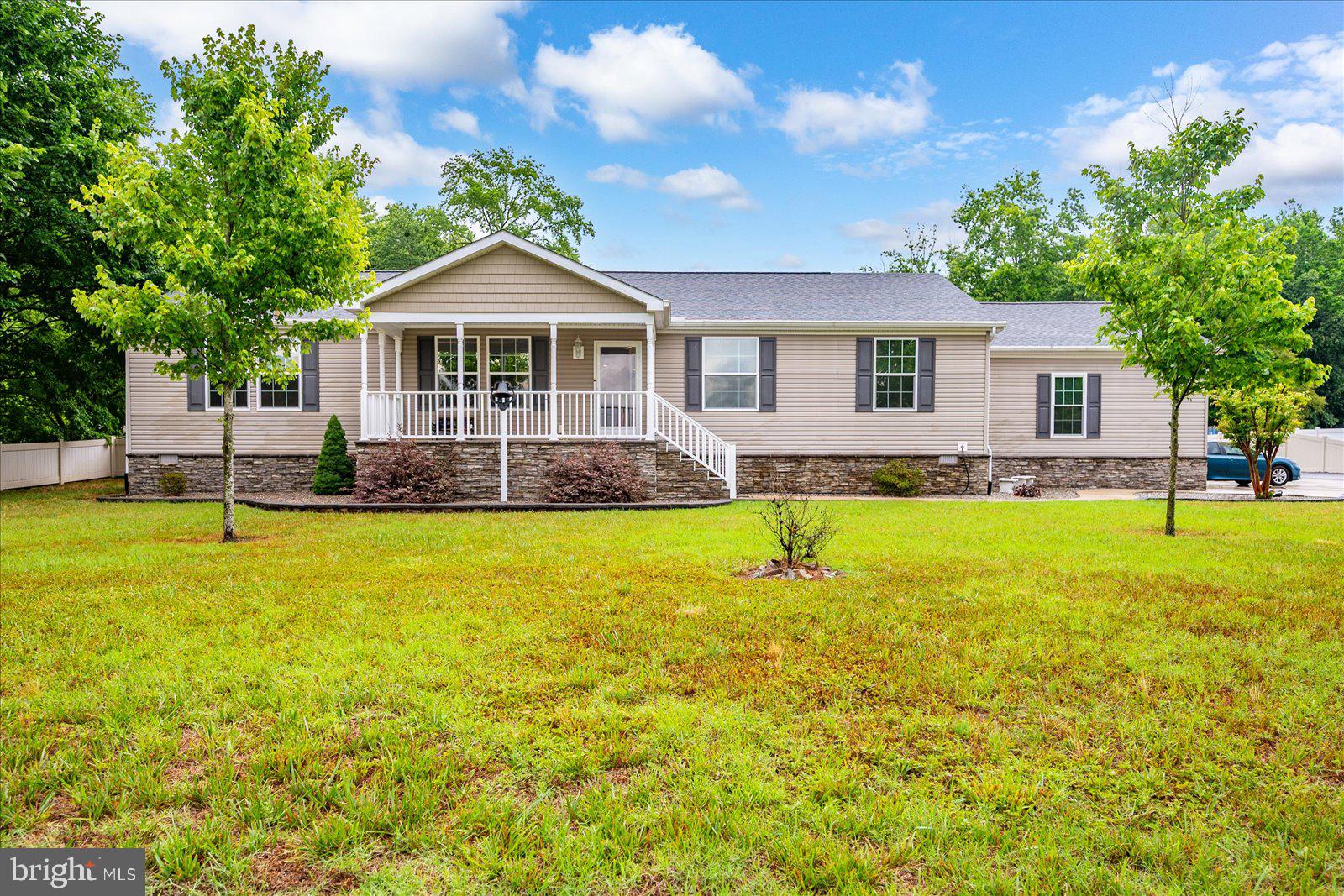 8225 Whitesville Road Pittsville, MD 21850 - Photo 1 of 45 a front view of a house with a yard
