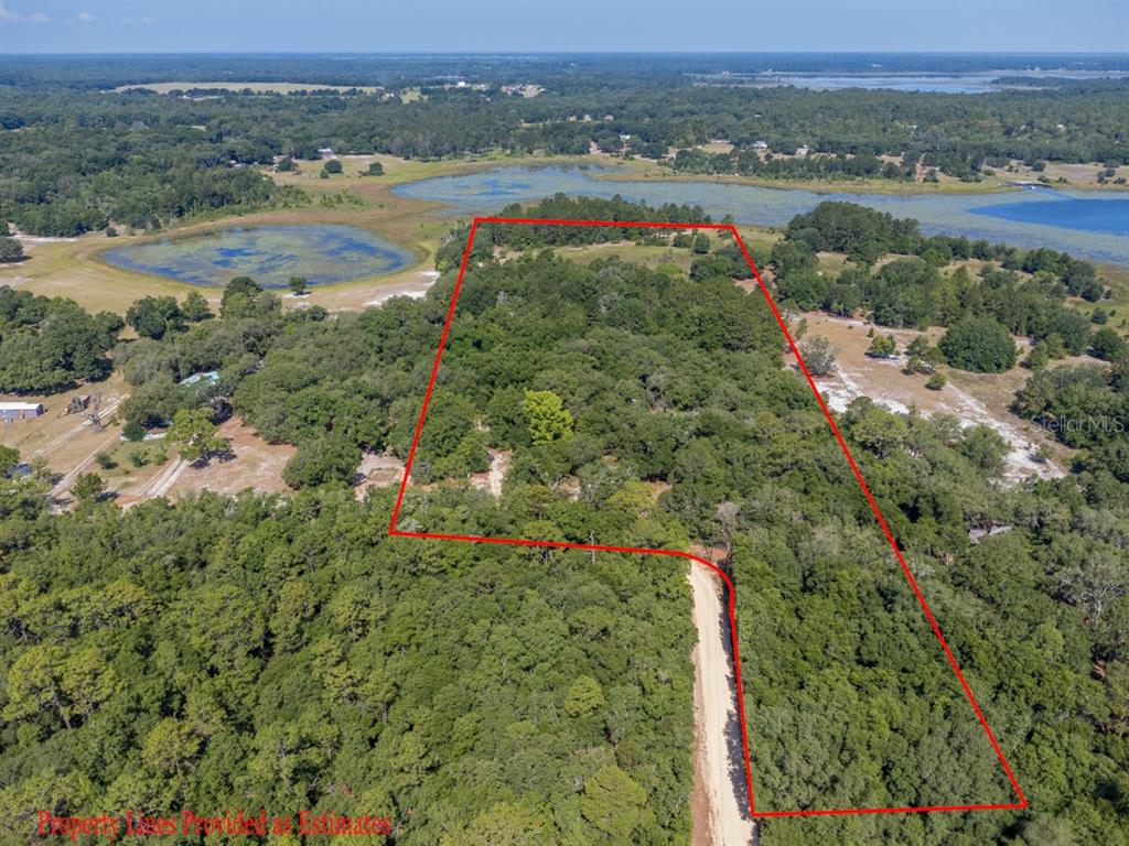 8118 County Line Road Melrose, FL 32666 - Photo 1 of 1 an aerial view of beach and residential houses with outdoor space