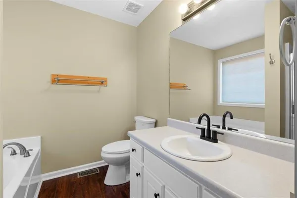 a bathroom with a tub and shower