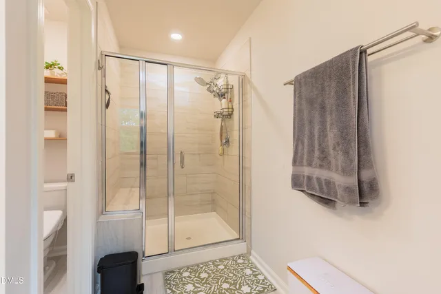 a view of an entryway with a floor to ceiling window