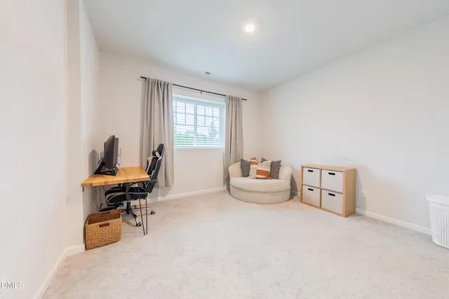 a workspace with furniture and a window