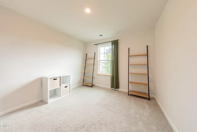 a bathroom with a sink a toilet and shower curtain