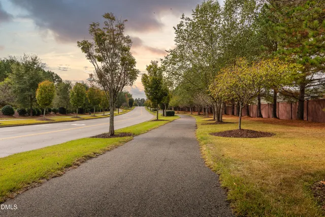 a swimming pool with outdoor seating and yard