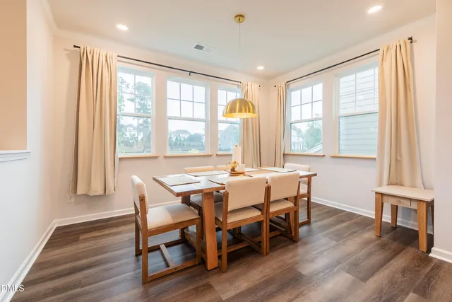 a dining room with wooden floor and wooden floor