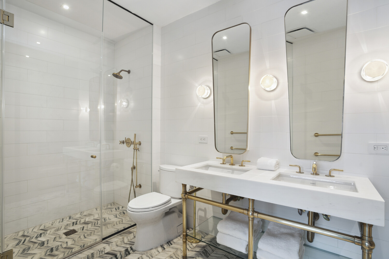 50 Clinton Street, Unit PHB Manhattan, NY 10002 - Photo 11 of 18 a bathroom with a sink a toilet and shower