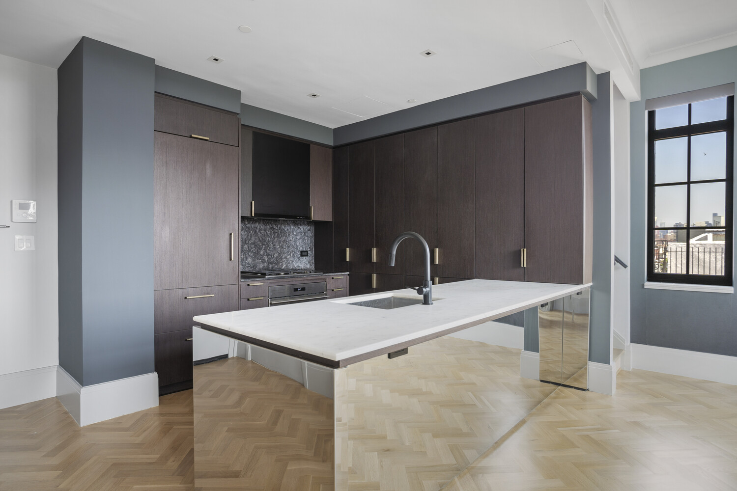 50 Clinton Street, Unit PHB Manhattan, NY 10002 - Photo 3 of 18 a kitchen with a sink refrigerator and cabinets