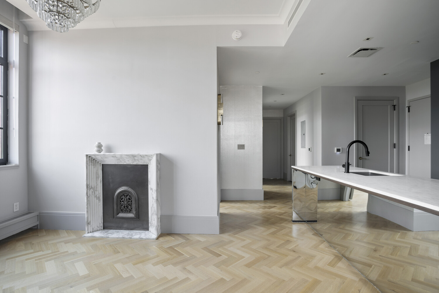 50 Clinton Street, Unit PHB Manhattan, NY 10002 - Photo 4 of 18 a view of a hallway with a sink and a washing machine
