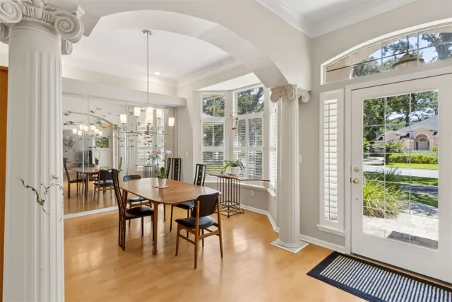 a view of a dining room with furniture window and outside view