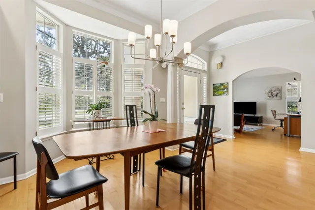 a dining room with furniture and window