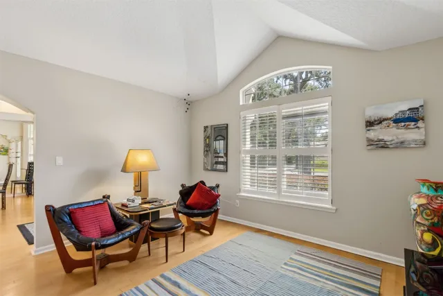 a living room with furniture and a window