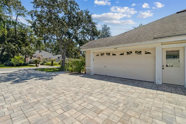 an empty room with closet and a ceiling fan