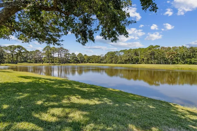 a view of a lake in between the city and lake