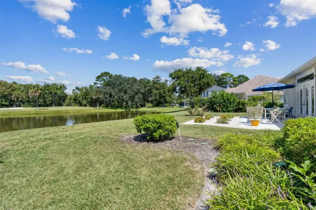 a house view with swimming pool and garden space