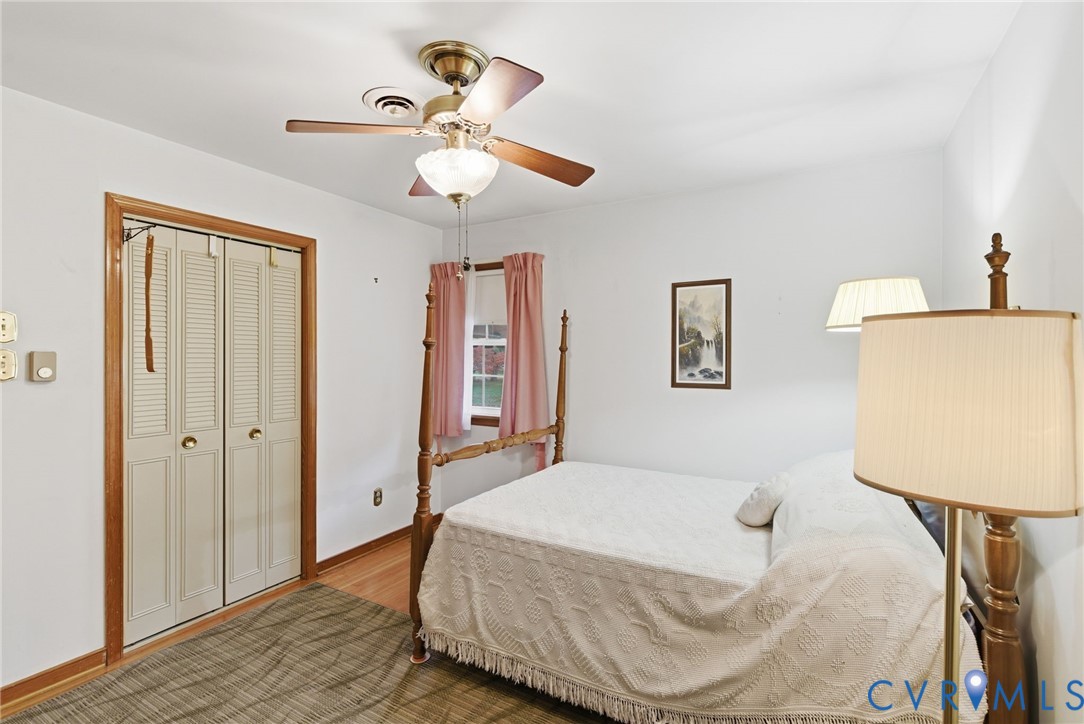 9093 Rutland Road Mechanicsville, VA 23116 - Photo 13 of 36 Bedroom with wood finished floors, a closet, and a