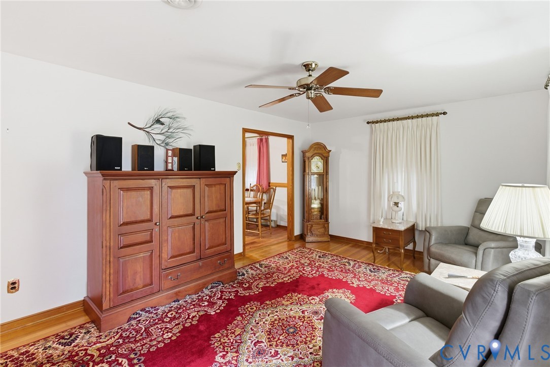 9093 Rutland Road Mechanicsville, VA 23116 - Photo 5 of 36 Living area with light wood-type flooring and a ce