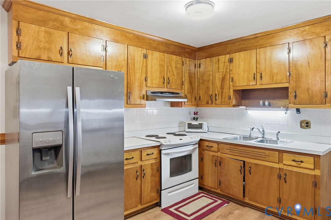9093 Rutland Road Mechanicsville, VA 23116 - Photo 8 of 36 Kitchen with stainless steel fridge, light counter