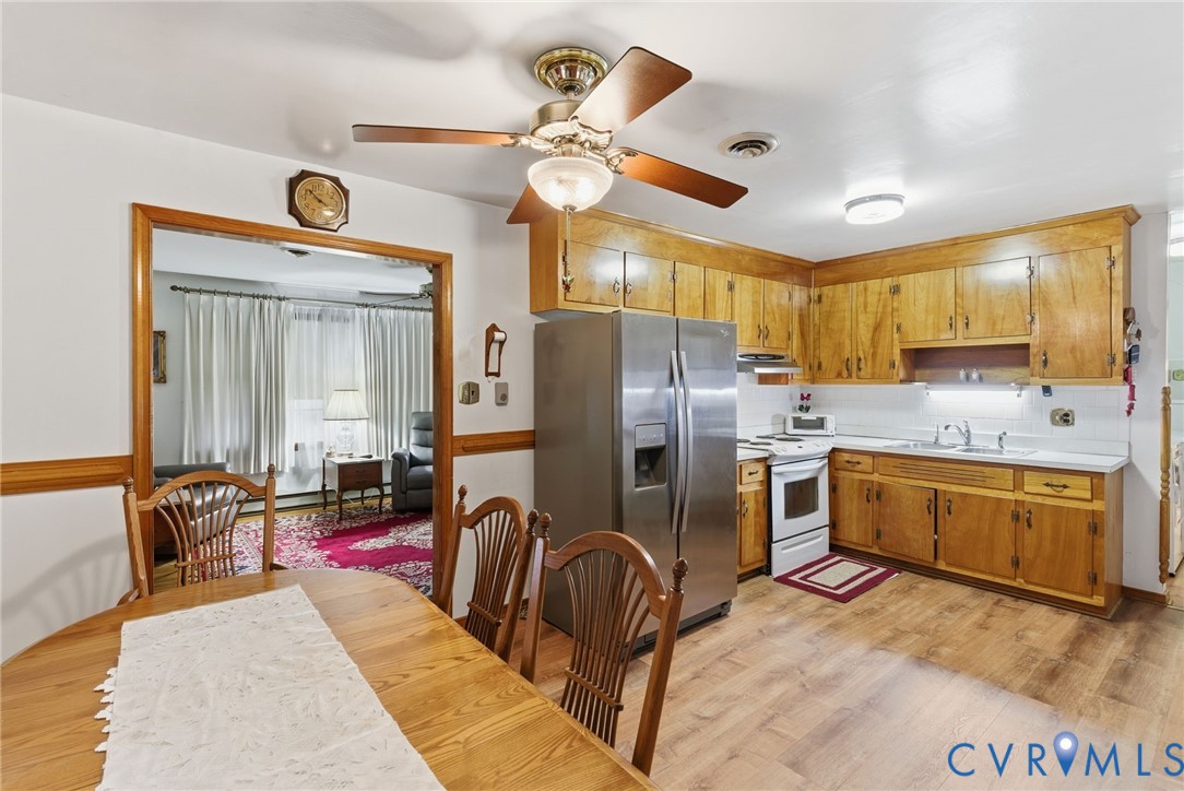 9093 Rutland Road Mechanicsville, VA 23116 - Photo 9 of 36 Kitchen with light countertops, stainless steel re