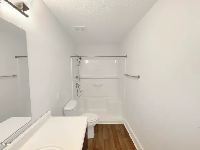 a bathroom with a sink and a shower