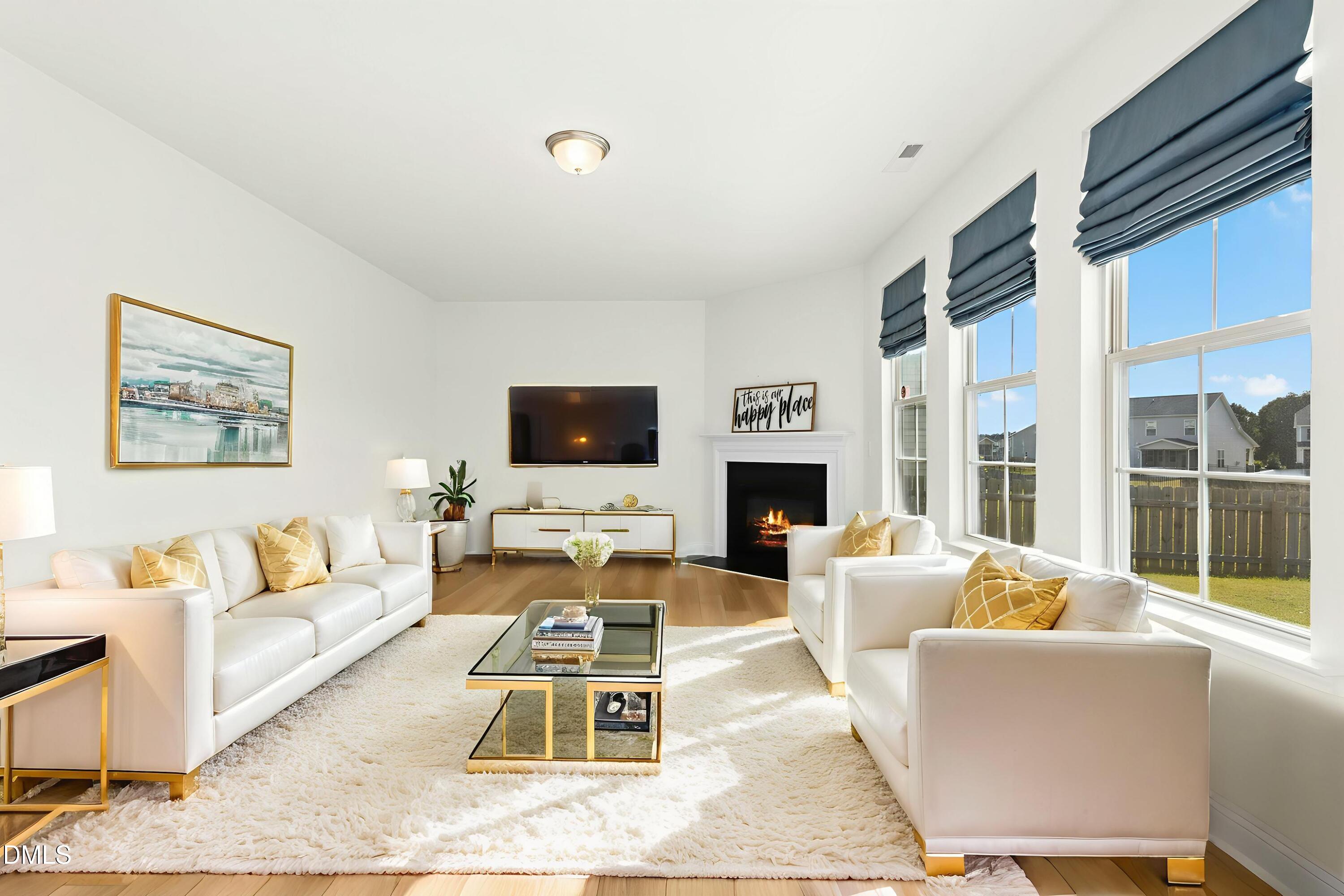 2133 Blue Iris Way Zebulon, NC 27597 - Photo 7 of 33 008-488165-IMG_1387 - Living Room - Luxu