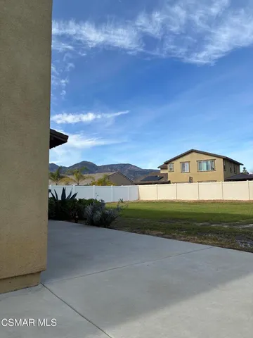 a front view of a house with yard