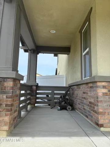 a lobby with furniture and window