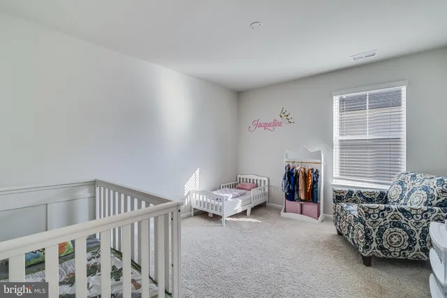 a bedroom with a bed and a television in it