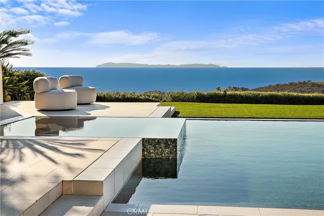 a view of a swimming pool with an ocean view