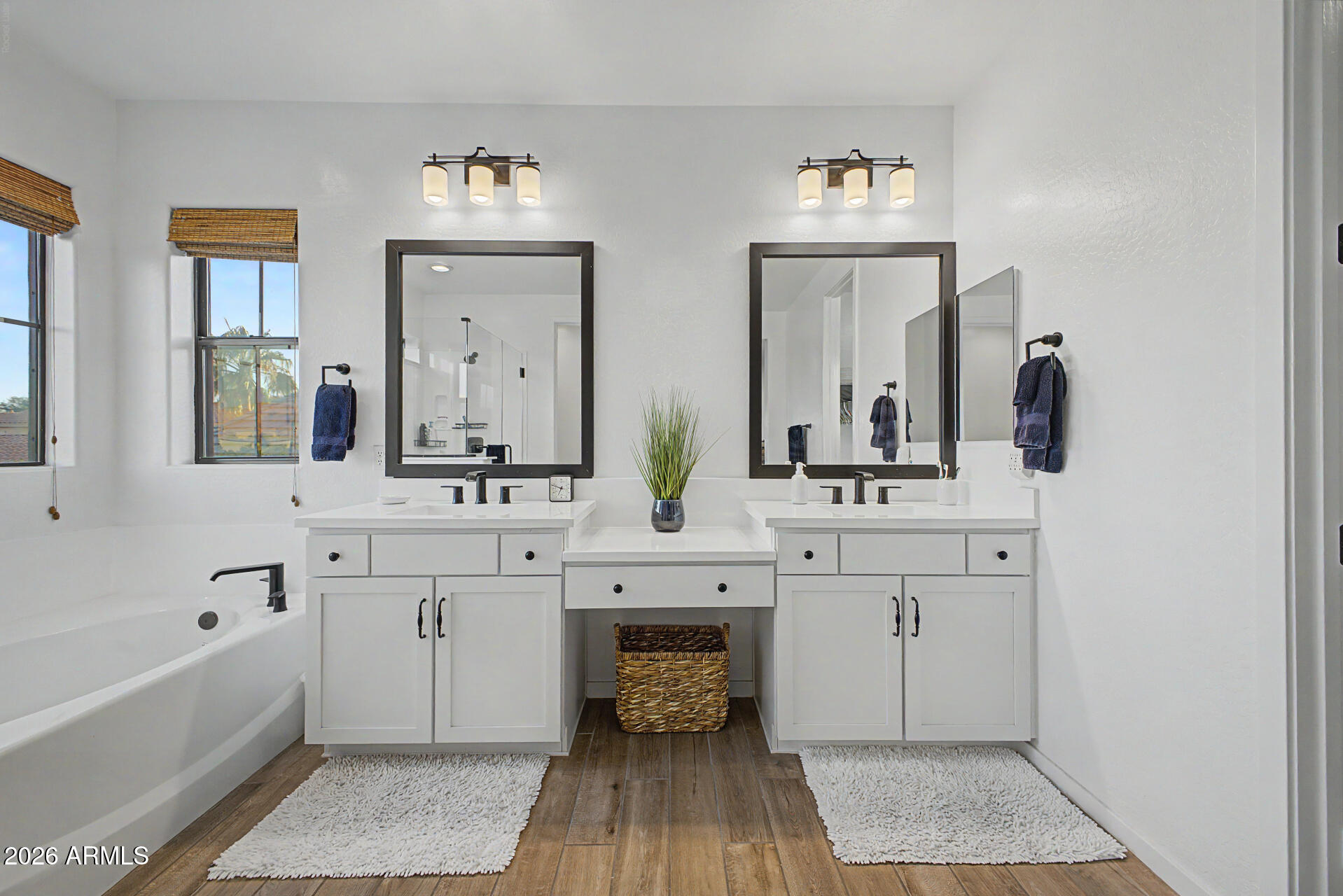 819 West Deer Creek Road Phoenix, AZ 85048 - Photo 37 of 76 a spacious bathroom with double vanity sinks and a bathtub