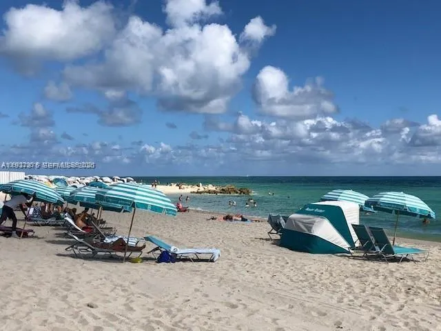 a view of a backyard with table and chairs