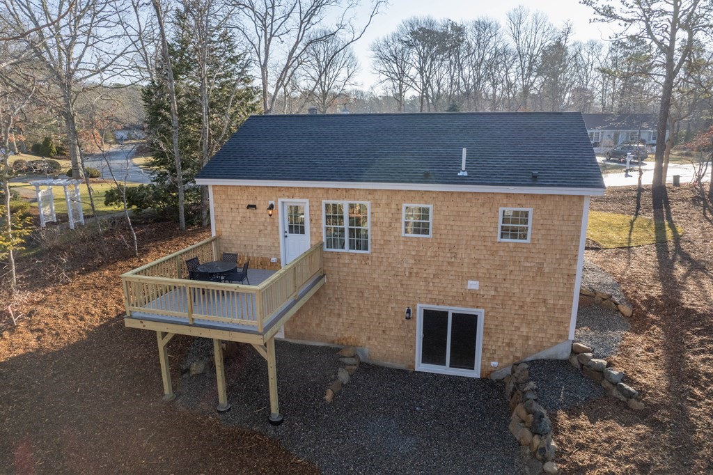 17 Indigo Lane Harwich, MA 02645 - Photo 1 of 30 a front view of a house with a yard