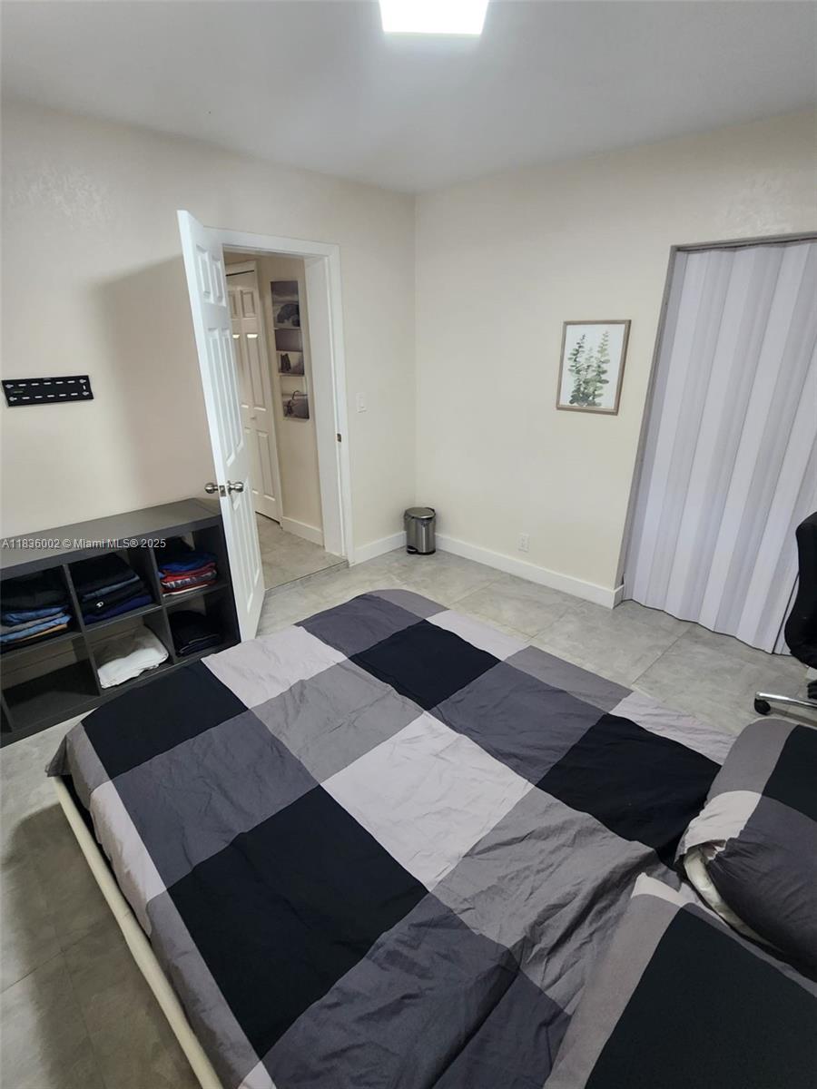 2165 Southwest 47th Street, Unit 2 Dania Beach, FL 33312 - Photo 8 of 10 a black and white photo of a living room