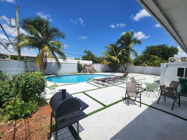 2165 Southwest 47th Street, Unit 2 Dania Beach, FL 33312 - Photo 10 of 10 a view of a chairs and table in patio