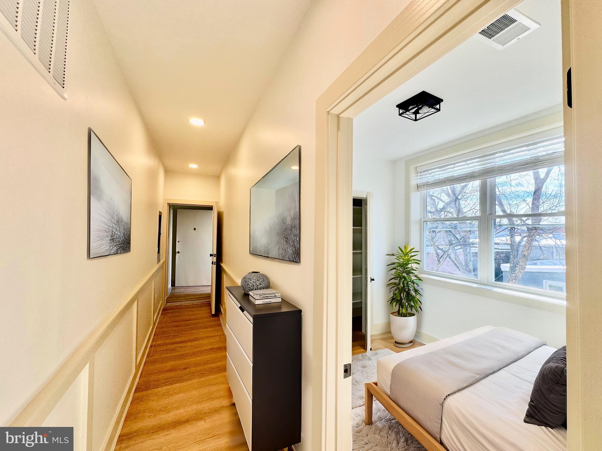 1802 11th Street Northwest, Unit 3B Washington, DC 20001 - Photo 5 of 19 a bedroom with furniture and a large window