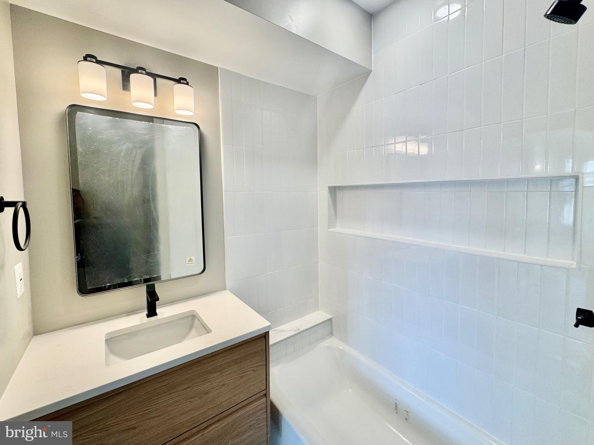 1802 11th Street Northwest, Unit 3B Washington, DC 20001 - Photo 7 of 19 a bathroom with a sink and a mirror