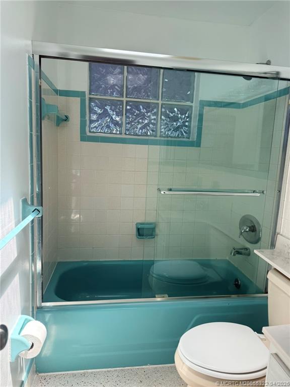 33 Southeast Sailfish Lane Stuart, FL 34996 - Photo 13 of 18 a bathroom with a toilet and a shower