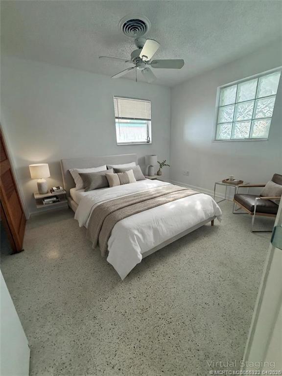 33 Southeast Sailfish Lane Stuart, FL 34996 - Photo 9 of 18 a bedroom with bed window and couch