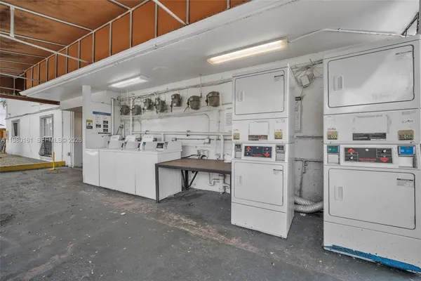 a utility room with cabinets