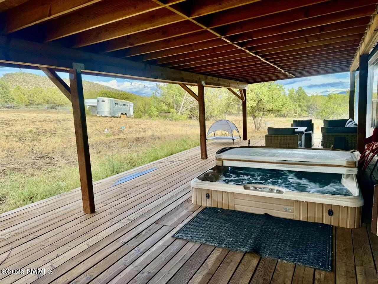 6083 North Joshua Tree Road Williams, AZ 86046 - Photo 13 of 40 a view of garden with deck and wooden floor
