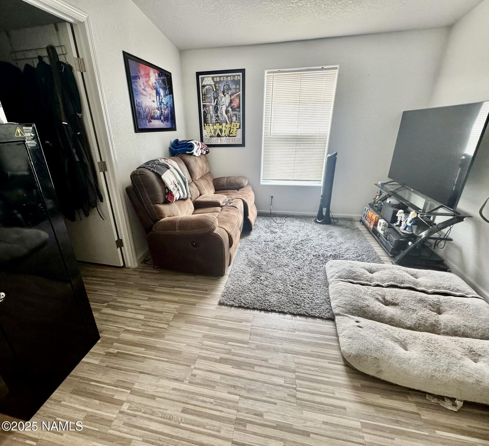 6083 North Joshua Tree Road Williams, AZ 86046 - Photo 22 of 40 a living room with furniture and a flat screen tv