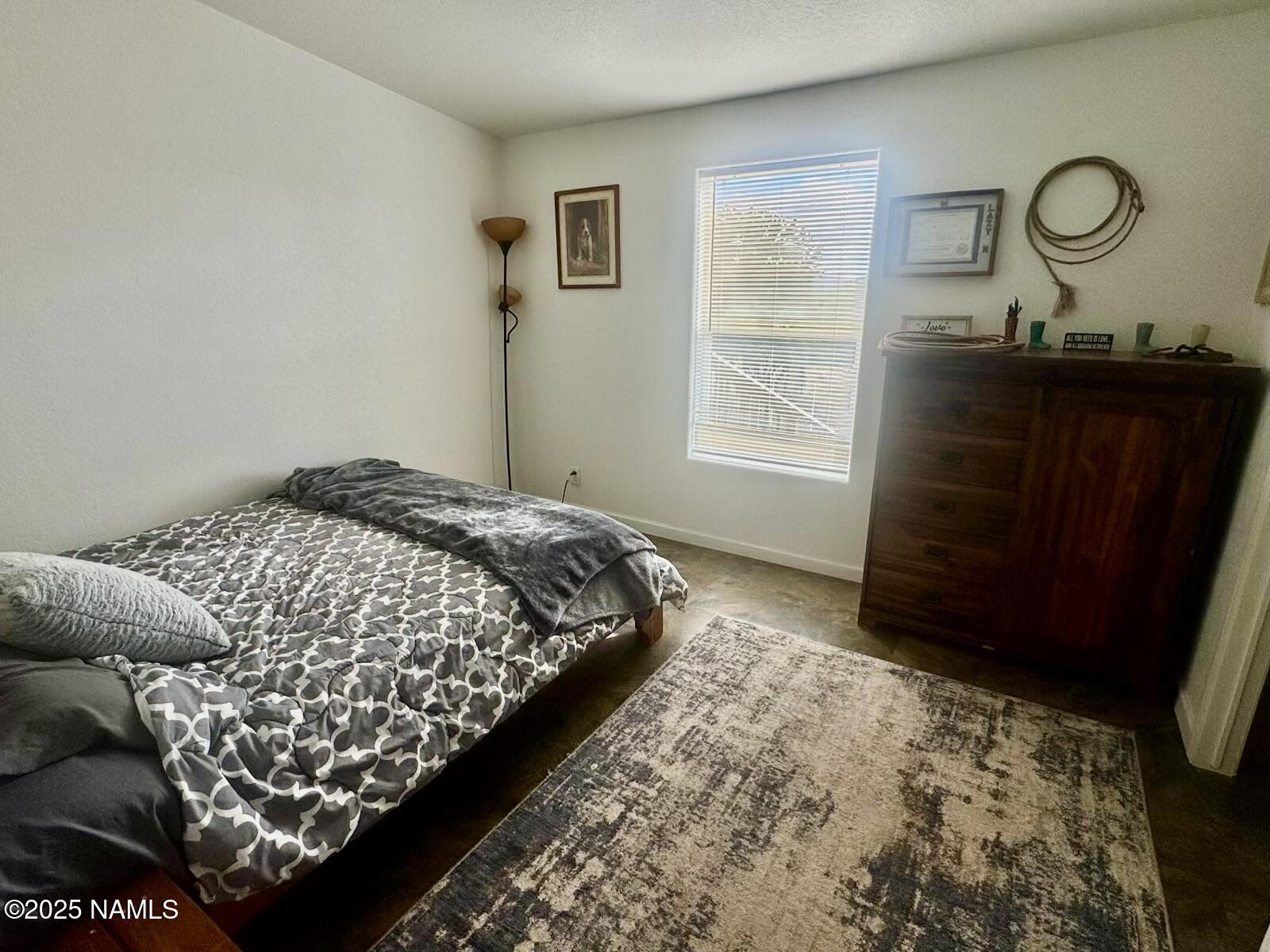 6083 North Joshua Tree Road Williams, AZ 86046 - Photo 23 of 40 a bedroom with bed and window