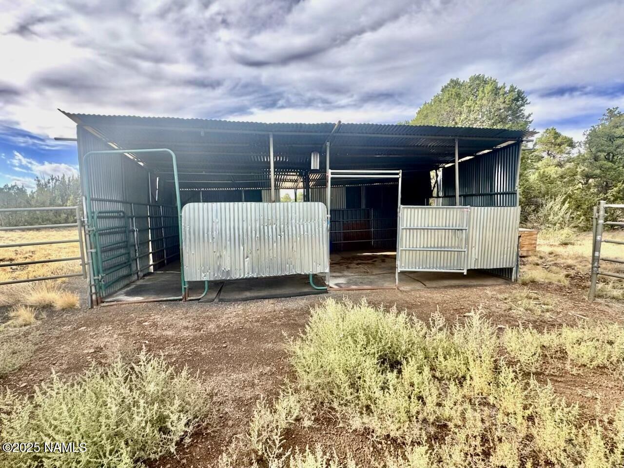 6083 North Joshua Tree Road Williams, AZ 86046 - Photo 25 of 40 a view of a house with a garage